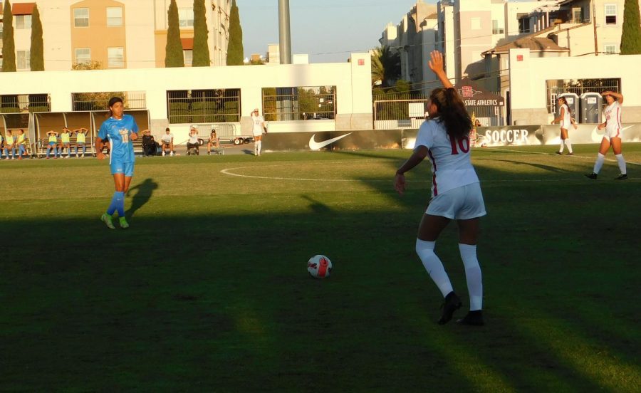 Junior+defender+Kiera+Utush+attempting+to+kick+the+ball+towards+her+teammates+early+in+the+first+half+against+UCLA.