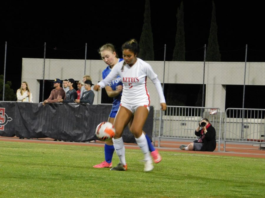 Sophomore forward Emma-Gaines Ramos (5) handling the ball with an Air Force defender.
