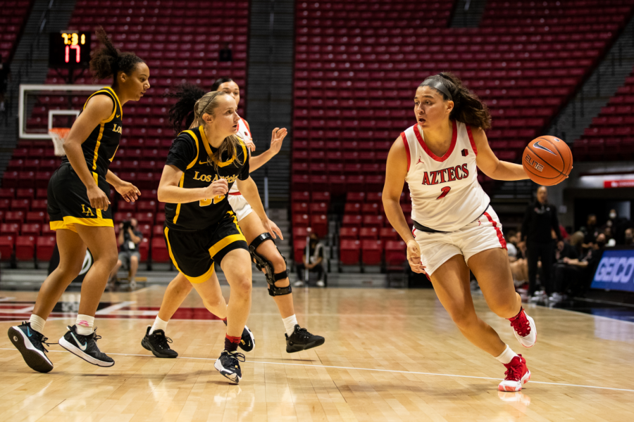Sophia Ramos (right) drives against two Cal State Los Angeles players in SDSU's 72-57 win (Photo courtesy of SDSU Athletics).
