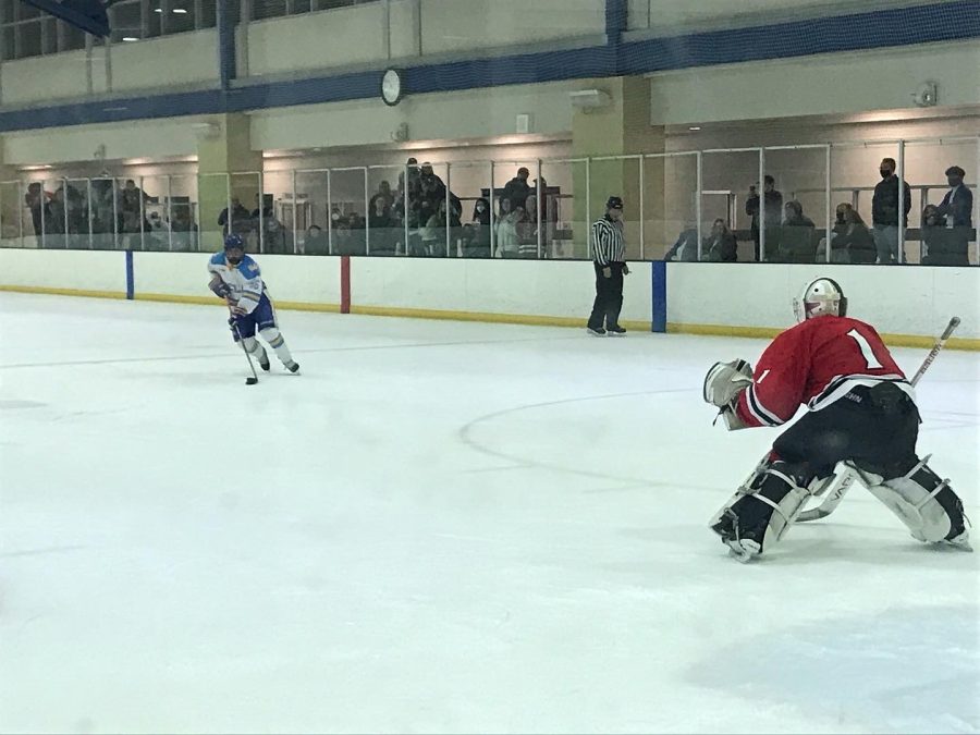 Goaltender Charlee Lerow (1) defends the net during an SDSU hockey match.