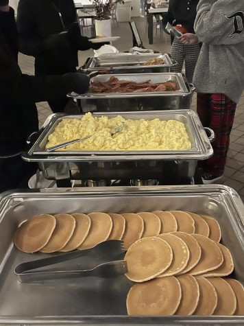 Students gathered in comfy clothes and helped themselves to a buffet of eggs, bacon and pancakes.