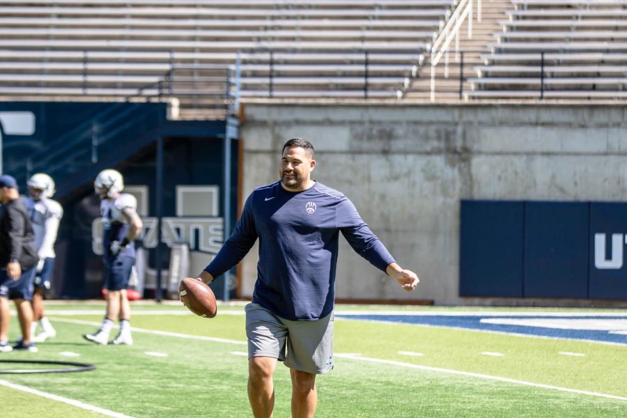 Justin Ena as a defensive coordinator with Utah State. (Photo courtesy of Utah State Athletics)