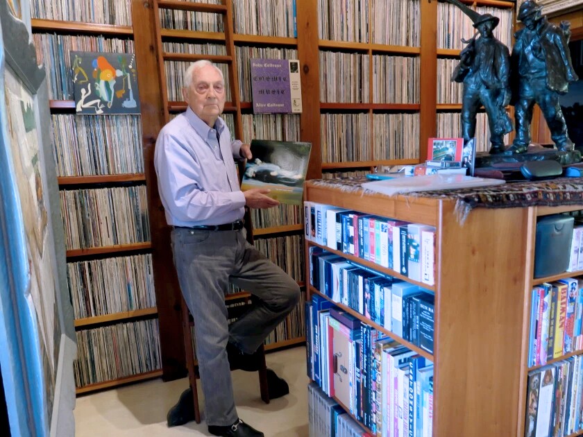 Bram Dijkstra with his collection of over 50,000 albums titled the John Coltrane Memorial Black Music Archive.