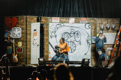 Rapper Teezo Touchdown appears onstage carrying a chainsaw, just one part of his demolition-themed set.