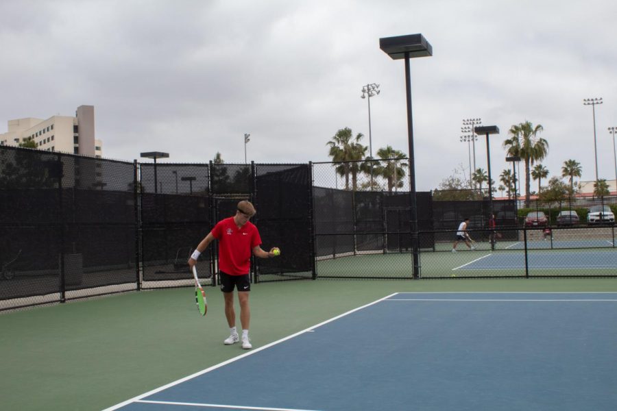 One of the Aztecs prepares himself for a serve against Utah State.