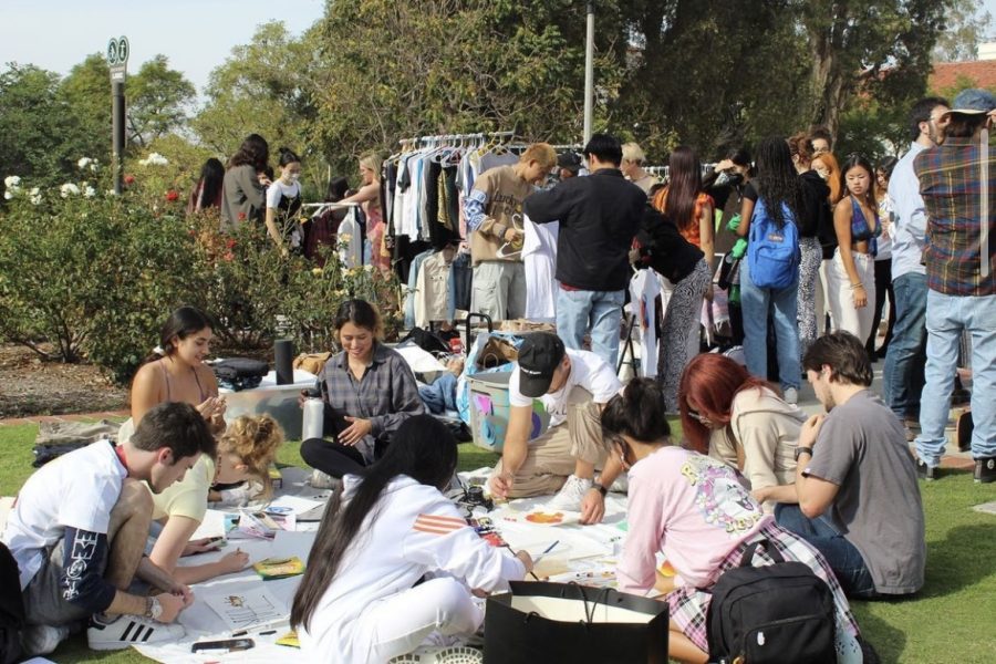 F*** Fast Fashion hosts a CREATIVESGIVING event with a free clothing exchange, painting and music on the grass in front of Hepner Hall on Nov. 18, 2021.