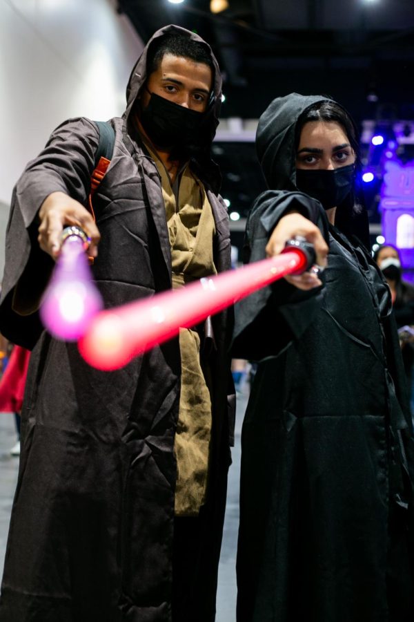 Erubey Robles and Elena Torres dressed as Star Wars Jedi at Comic-Con.
