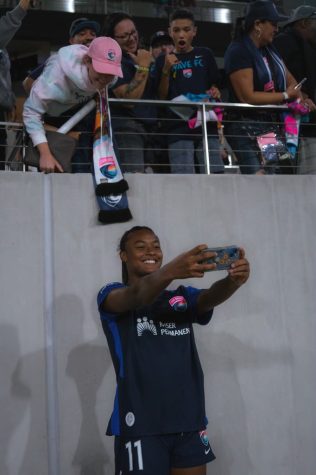 San Diego Wave forward Jaedyn Shaw takes a selfie with fans following their 1-0 win against Angel City FC on Saturday, Sept. 17, 2022