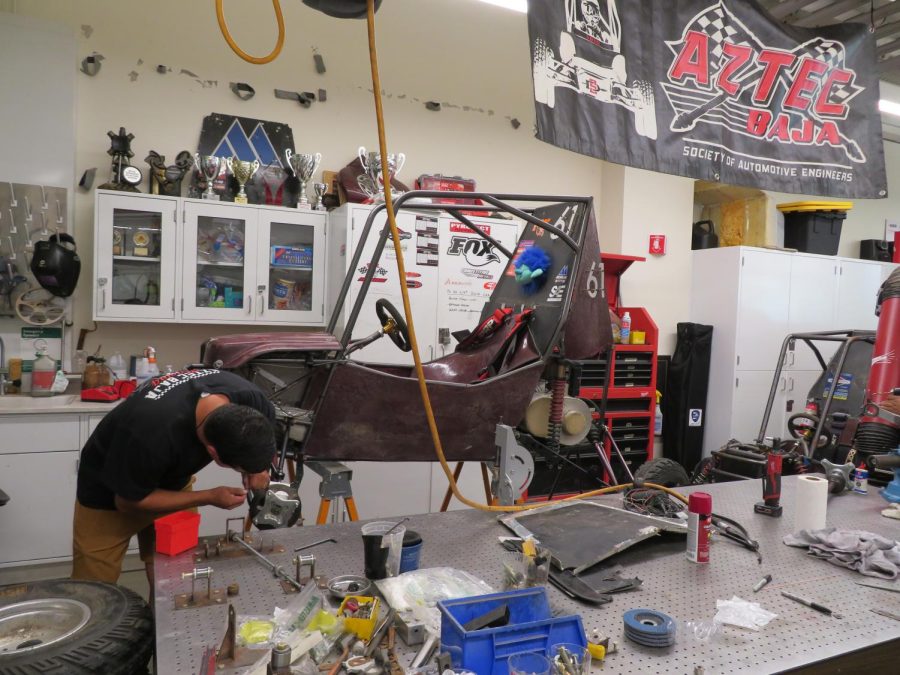 Manuel Aldana works on the Aztec Baja Racing team's vehicle in preparation for this year's race, Sep. 12, 2022.