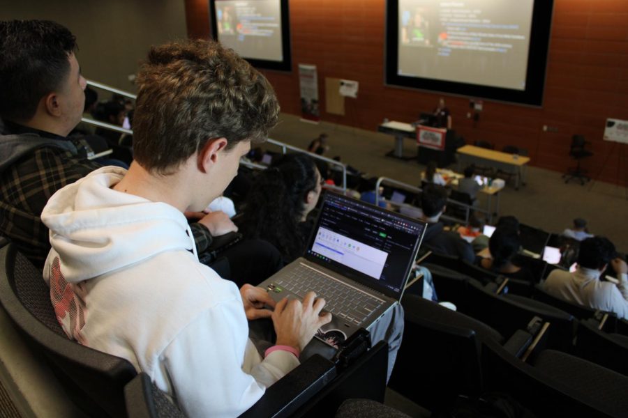 SDSU sophomore Micah Hacker uses his computer science skills to push new GitHub commit to help his team compete at the SDSU Hackathon on October 8th, 2022.