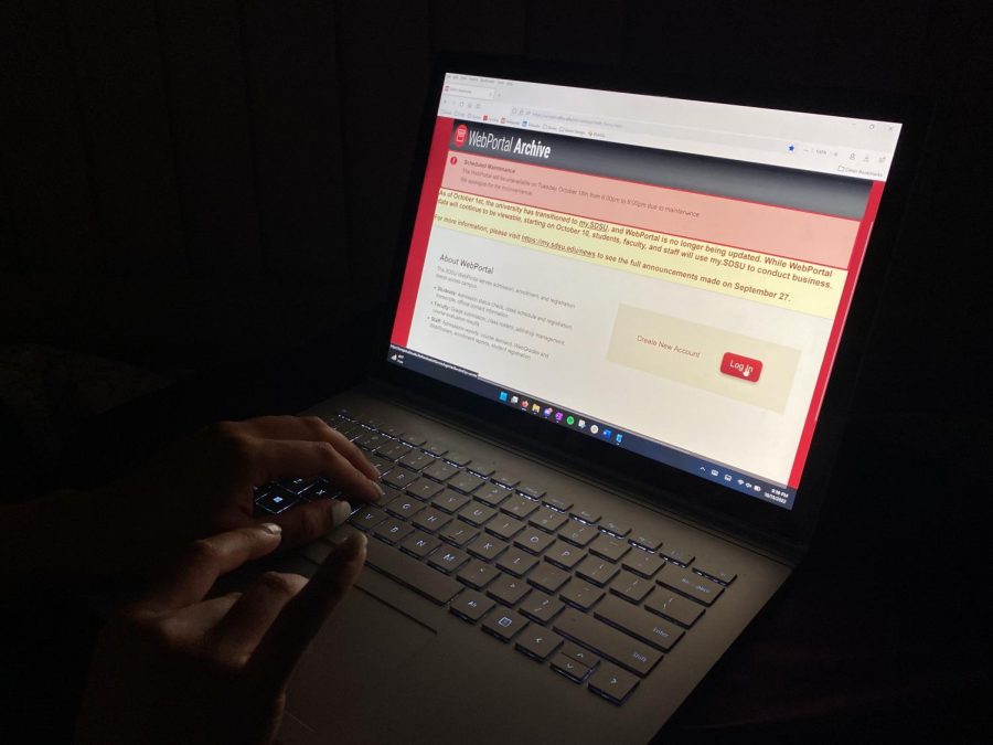 A student looks at the WebPortal website that states all updated student information will be moved to My.SDSU.