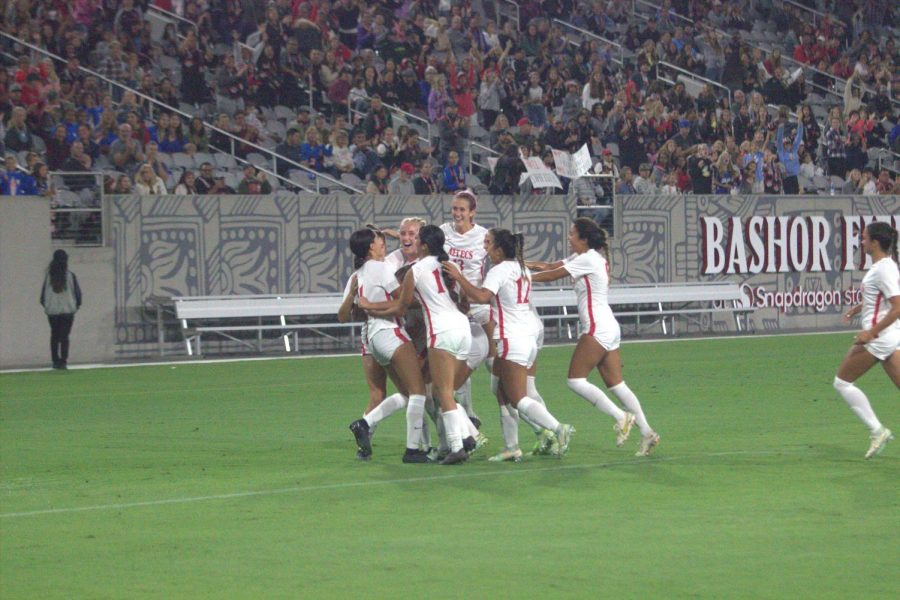 The Aztecs celebrate scoring their first goal at Snapdragon Stadium during the match against San José State on Thursday, Oct. 6, 2022. 