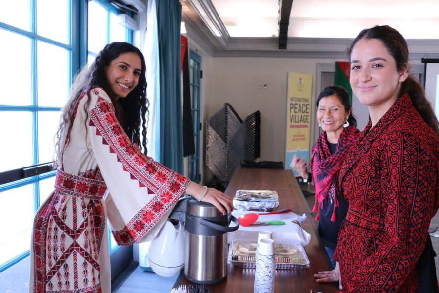 Zaina Zubaidi serving Arabic coffee and dessert with attendees Amena Radwan and Layalee Zeidan.