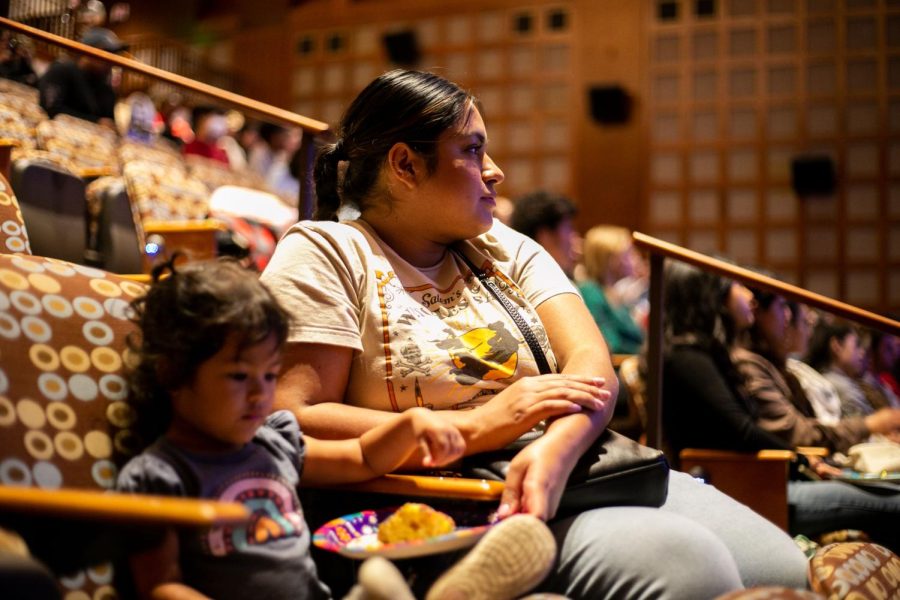Fourth year student Nancy Martinez sits next to her daughter Berkeley Martinez during the JMS Screening Circle Series that featured the film Coco.
