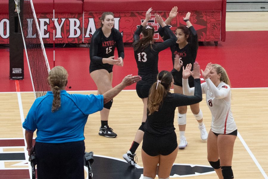 The Aztec volleyball team celebrates after scoring a point against Air Force on Oct. 22. The team is 3-1 in their last four games heading into its regular season finale. 