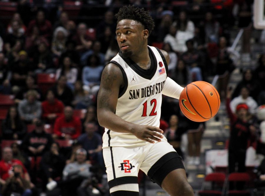 Senior Darrion Trammell leading the Aztec attack against Troy at Viejas Arena on Dec. 5, 2022.