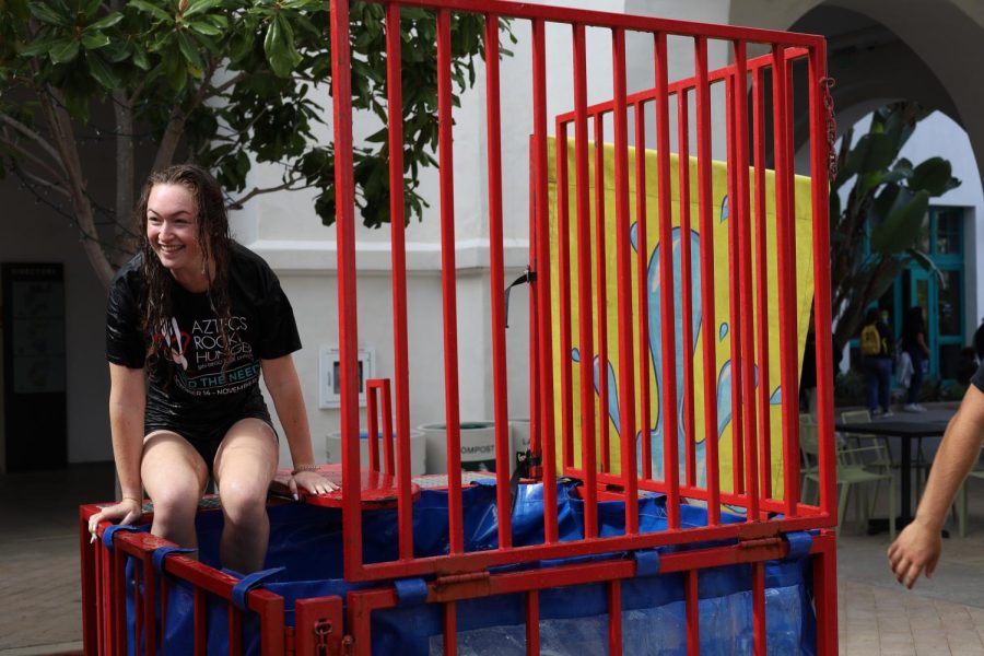 Olivia Hansen smiles after getting dunked at the Aztec Rock Hunger Carnival. The carnival helped raise money to fight food insecurity.