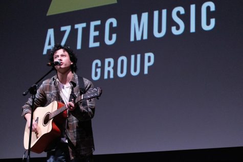Joaquin Paez performs his original song titled Living Proof in the Montezuma Hall Theatre on Dec. 6.