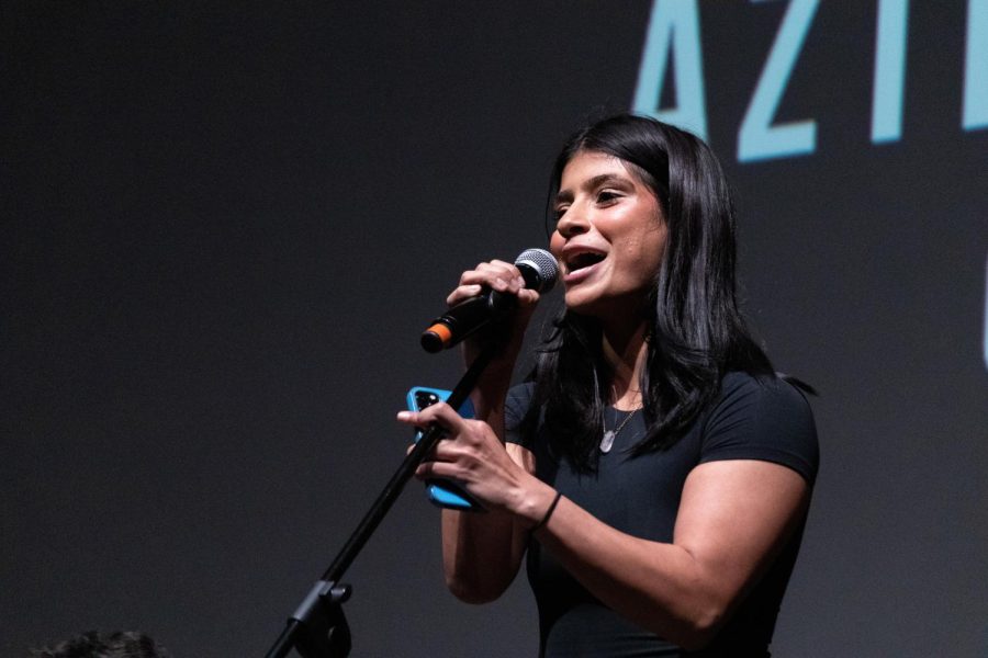 Event organizer and fourth year business marketing major Leila Zonoobi performs a cover of indie hit 3 Nights by Dominic Fike in the Montezuma Hall Theatre on Dec. 6.