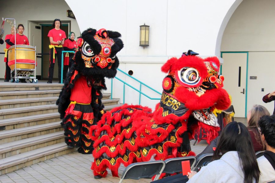 Four performers from Luky Lion Dancers take the stage at the Conrad Prebys Aztec Student Union to celebrate Lunar New Year. 