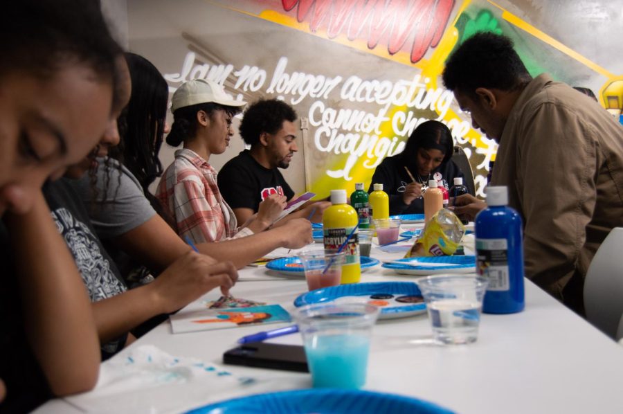 Students paint during Paint Talks at SDSUs Black Resource Center on Feb. 9.
