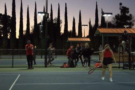 SDSU teammates run onto the court as senior Alicia Melosch celebrates immediately after winning the decisive match against Alabama on Jan. 27, 2023.