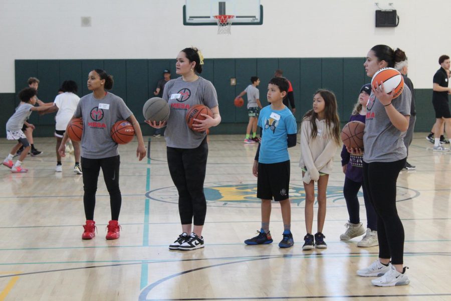 Asia Avinger, Khylee Pepe and Meghan Fiso coaching the kids form the Boys and Girls Club. 