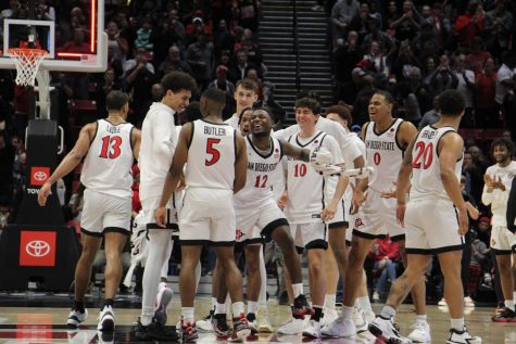 The Aztec mens basketball team celebrate a win over rival Boise State on Feb. 3, 2023. 
