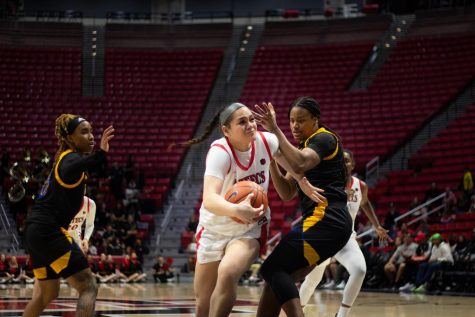 SDSU sophomore Khylee Pepe drives through contact into the paint versus SJSU on Jan. 28, 2023.