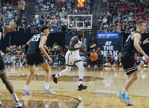 Senior forward Aguek Arop looks for a teammate during the 2023 Mountain West Championship Game versus Utah State on March 11.