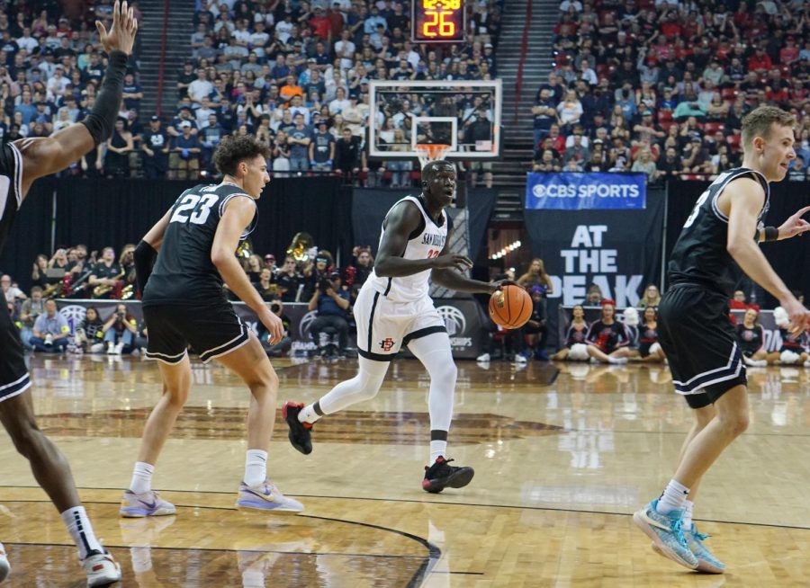 Senior+forward+Aguek+Arop+looks+for+a+teammate+during+the+2023+Mountain+West+Championship+Game+versus+Utah+State+on+March+11.