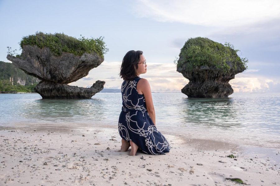 Brittany Cruz-Fejeran sits at Hilaan Beach, famous for its Mushroom Rocks in Guam, June 2022.  Photo courtesy of Ciana Rosario.