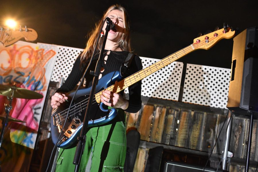 Cami Robertson plays a bass guitar and sings for Lucid Dream at The Look house show on March 5, 2023. 