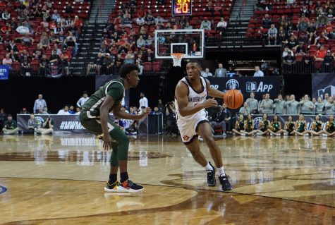 Junior guard Lamont Butler drives on senior guard Isaiah Stevens in the Mountain West quarterfinals on March 9, 2023. 
