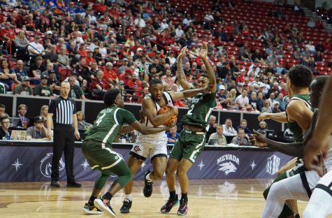 Junior guard Lamont Butler drives through two Colorado State defenders in the Mountain West quarterfinals on March 9, 2023.