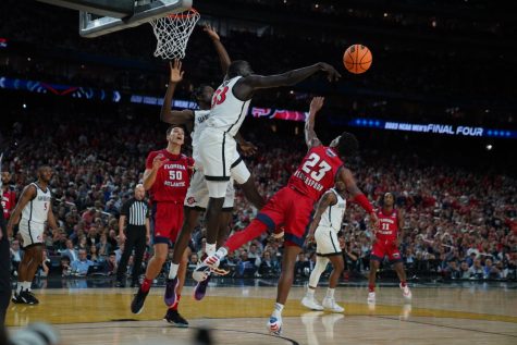 Senior Aguek Arop erases a shot during SDSU's 72-71 win over FAU in the Final Four on Saturday, April 1.