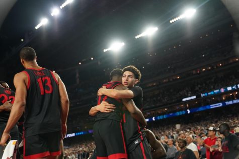 SDSU senior Darrion Trammell and freshman Miles Byrd embrace following SDSU's 76-59 loss to UConn in the National Championship on Monday, April 4.