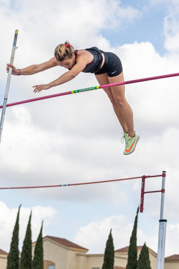 Senior Corey Friedenbach vaults over the pole at the Aztec Invitational on March 25.  