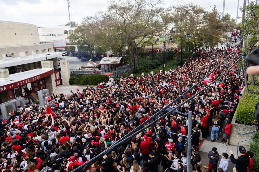 Aztec fans swarm the gates at Viejas Arena on Monday, April 3 in San Diego, CA.