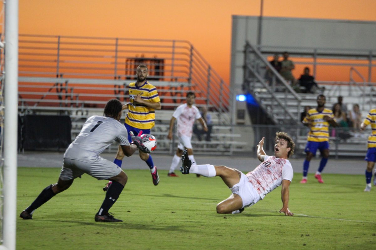San Diego State forward Austin Brummett (10) narrowly misses deflecting a cross to the box as Cal State Bakersfield goalkeeper Brandon Limes (1) gathers the ball in on Monday, Aug. 28 at the SDSU Sports Deck. The Aztecs beat the Roadrunners 1-0. 