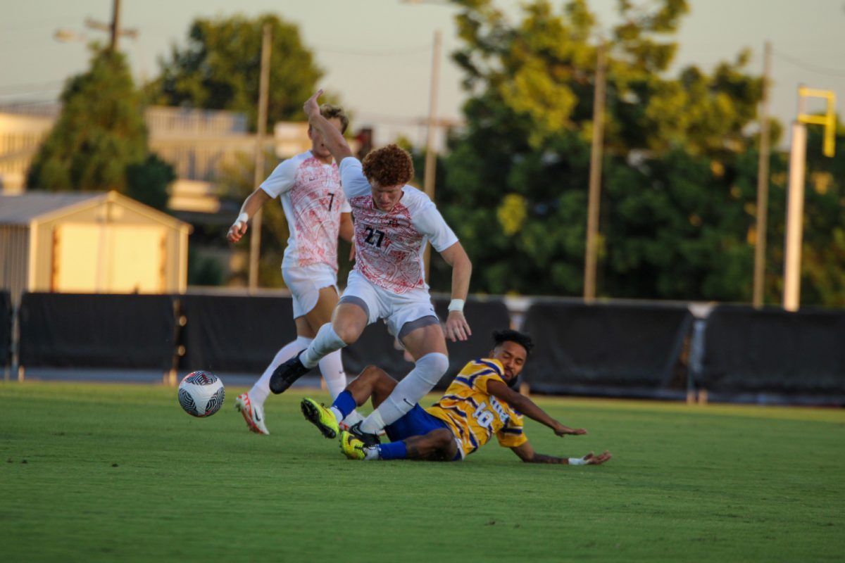 San Diego State defender Reid Fisher (27) gets taken down from behind by Cal State Bakersfield forward Nathan Jimenez (10) during the Aztecs 1-0 win on Monday, Aug. 28 at the SDSU Sports Deck. Jimenez was given one of four yellow card cautions against the Roadrunners.