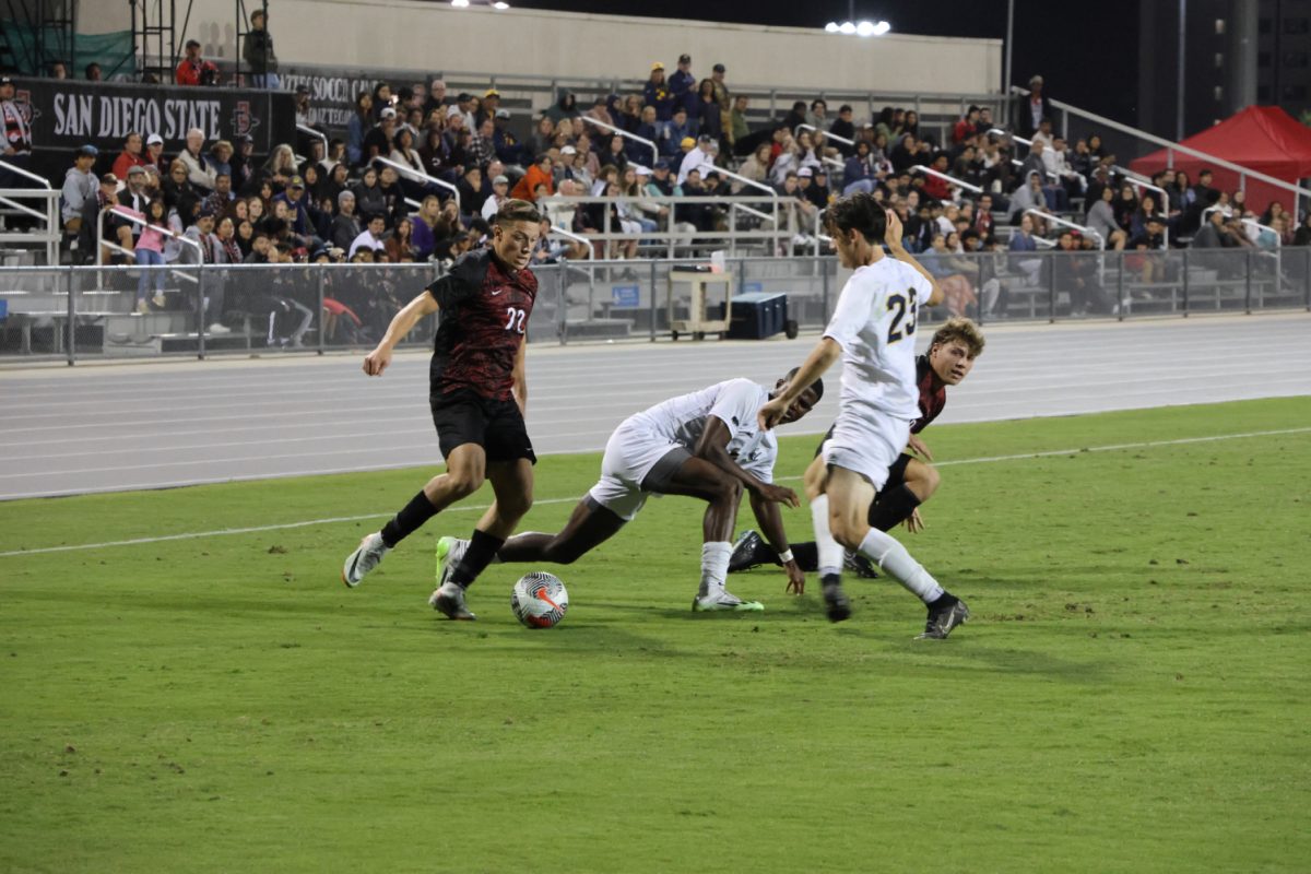 San Diego State forward Rommee Jaridly (22) takes on Cal defender Cameron Robie (23) on Thursday, Sept. 28 at the SDSU Sports Deck. The Golden Bears topped the No. 17 Aztecs 1-0 in the Pac-12 conference opener.