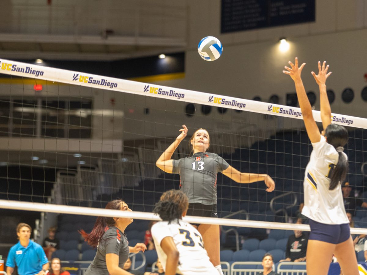 San Diego State middle blocker Julia Haynie rises for a spike against UC San Diego in the UCSD Invitational on Thursday, Sept. 7 at UCSDs LionTree Arena.