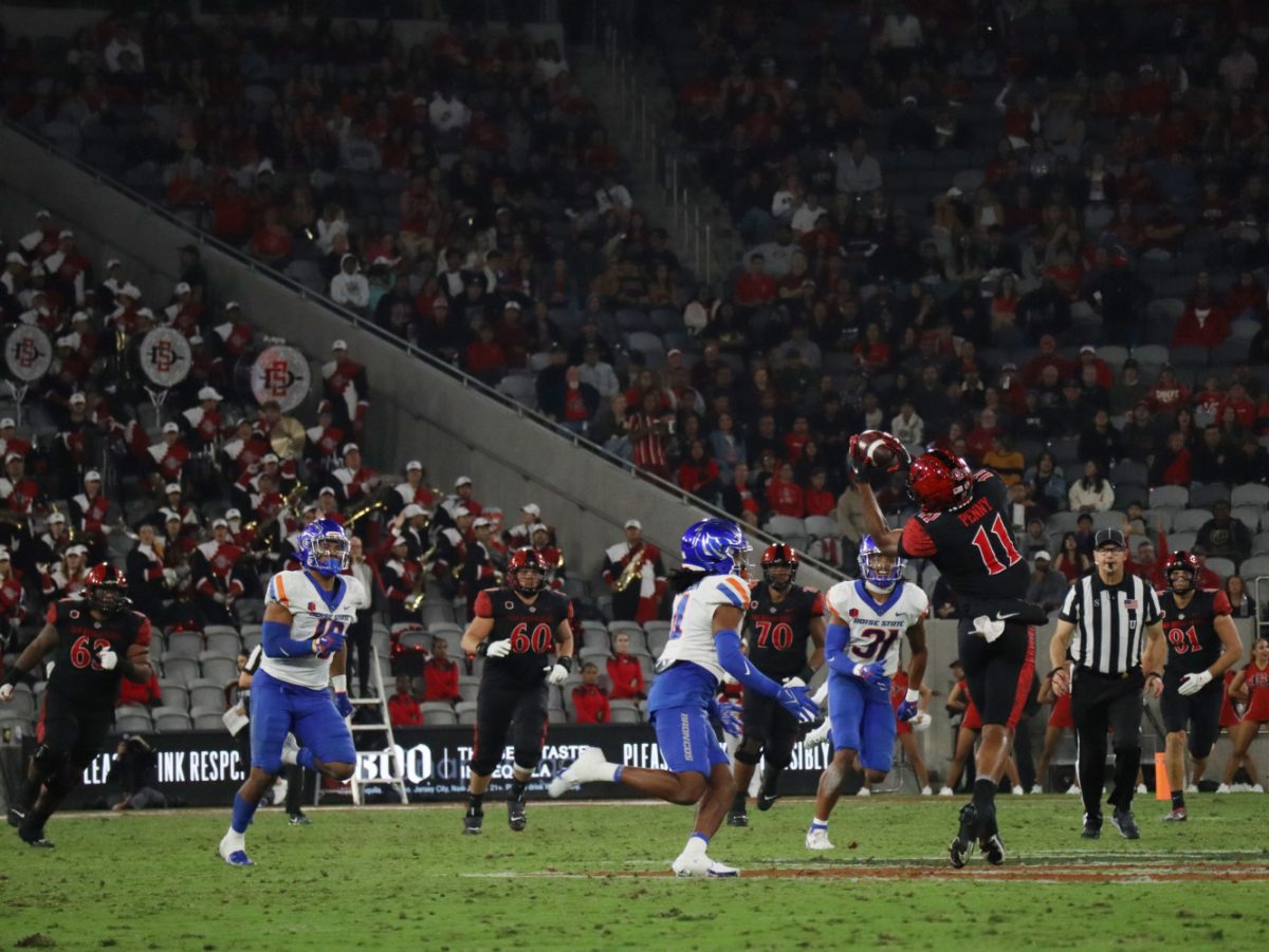 San Diego State running back Martin Blake (13) passes the ball to Brionne Penny (11) for a 32-yard gain on Friday, Sept. 22 at Snapdragon Stadium.
