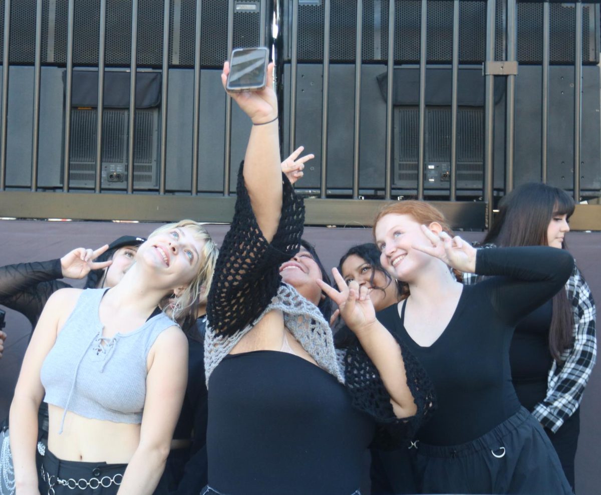Speech language hearing science major Ezri Jarman (far right) takes a selfie with her co-dancers at Gallagher Square for the Padres Korean Heritage night pre-show on Sept. 19, 2023.