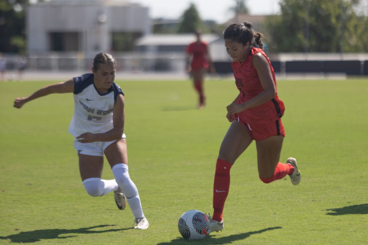 San Diego State forward Emma Gaines-Ramos drives possession against Utah State defender Kylie Olsen on Sunday, Oct. 8 at the SDSU Sports Deck. Gaines-Ramos scored her fifth goal of the season in the 2-1 Aztecs win.