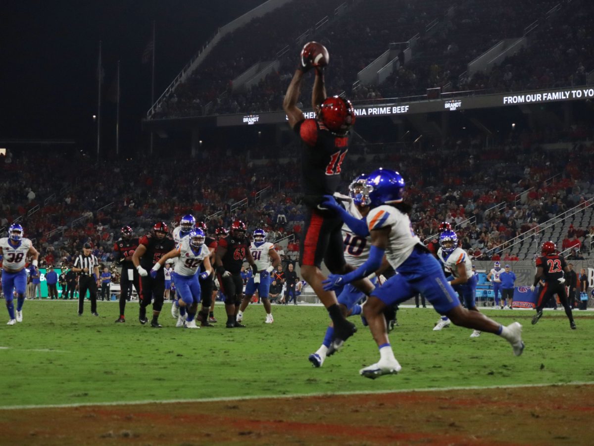 San Diego State wide receiver Brionne Penny leaps to make a catch near the goal line against Boise State at Snapdragon Stadium.