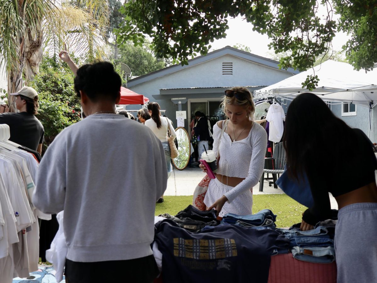 A student stops to look at a vendor's offerings.