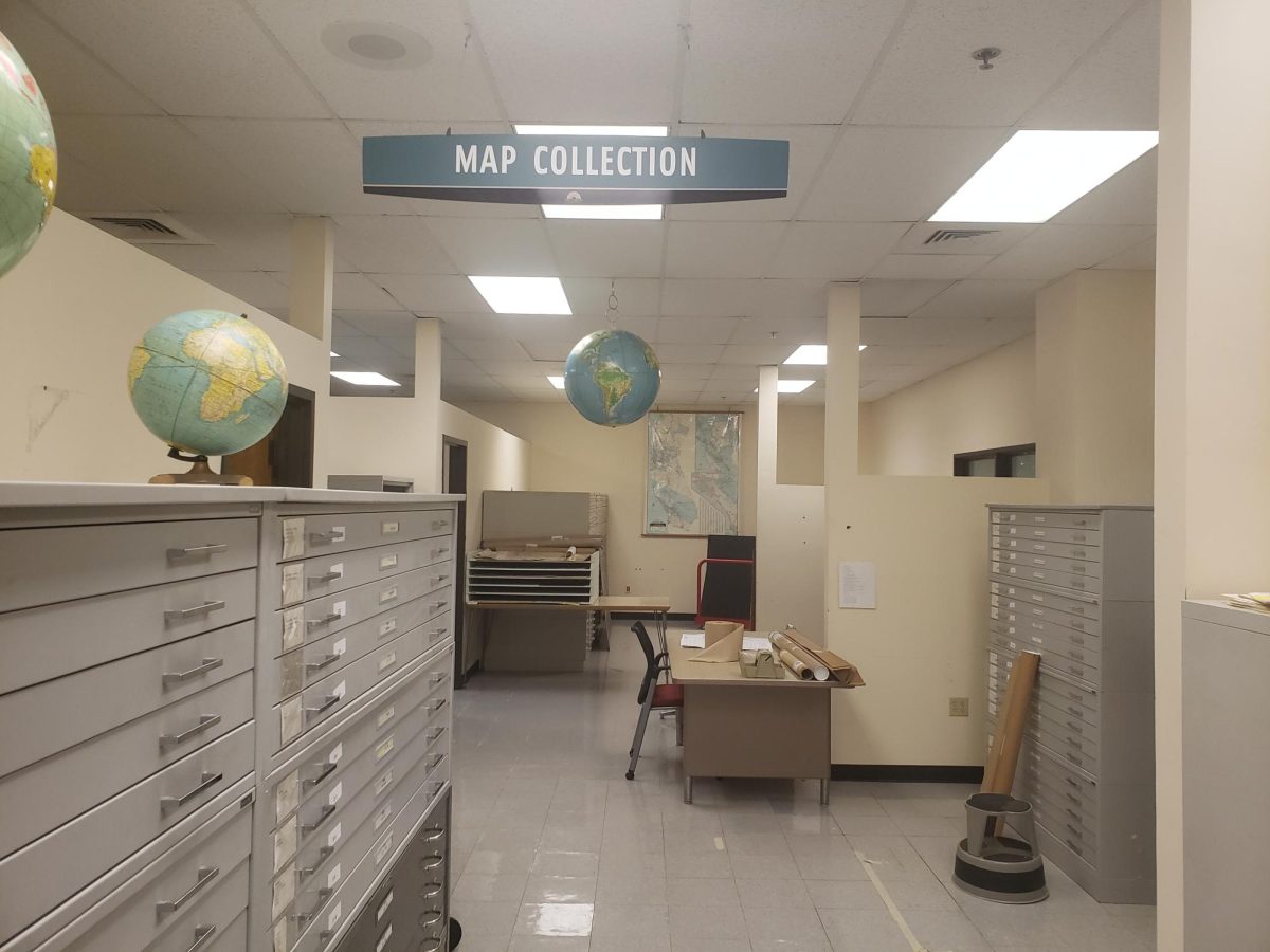 A sign signifies the location of the map room in the SDSU Library Addition. 