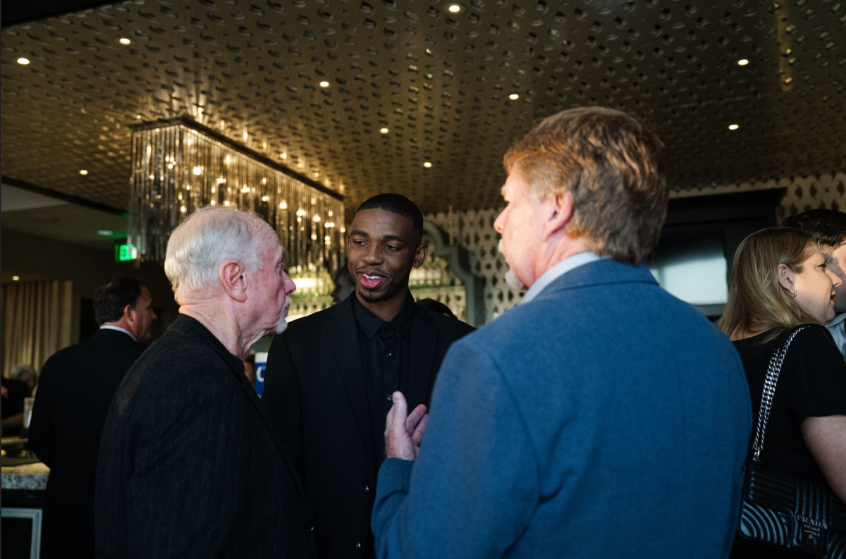 Lamont Butler chats with supporters of MESA Foundation at the Top of the Key event on Oct. 26, 2023.